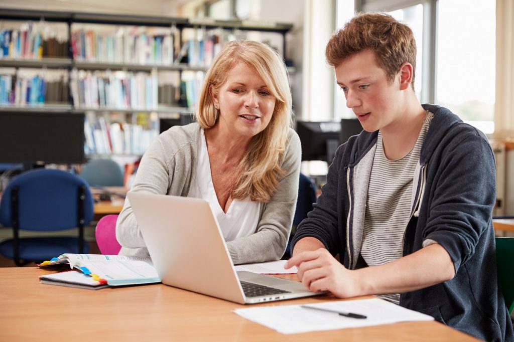 Student with his mom in the library