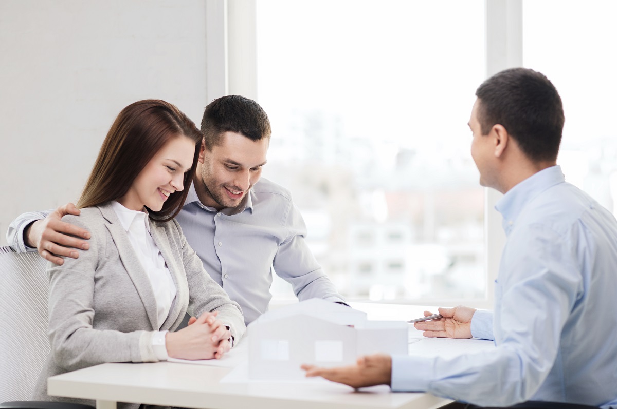 Couple with a real estate agent