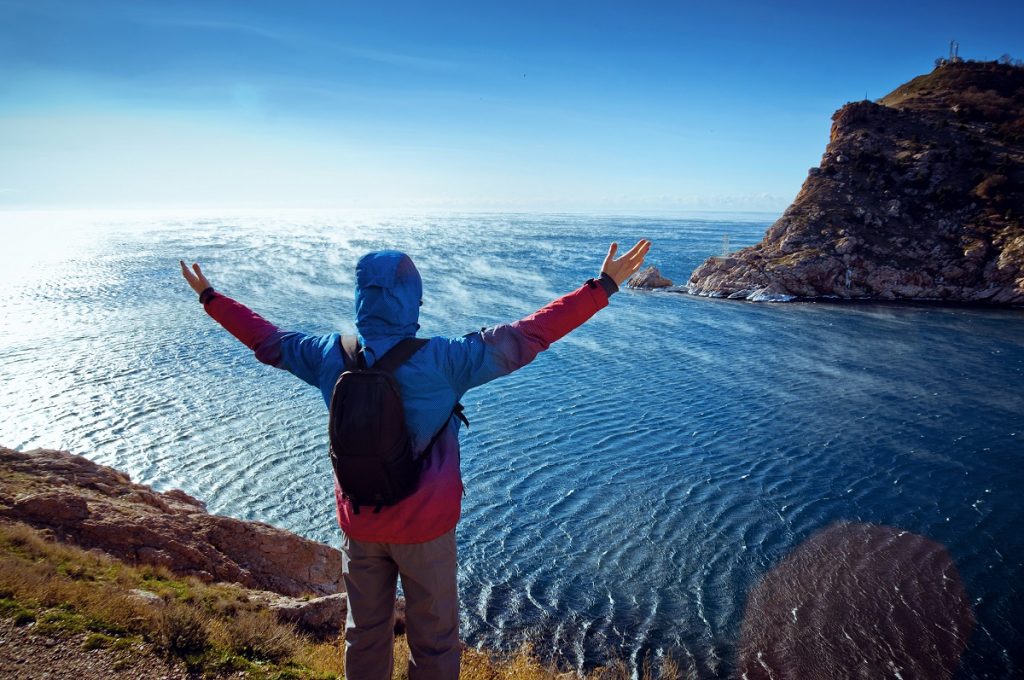 Hiker with open arms