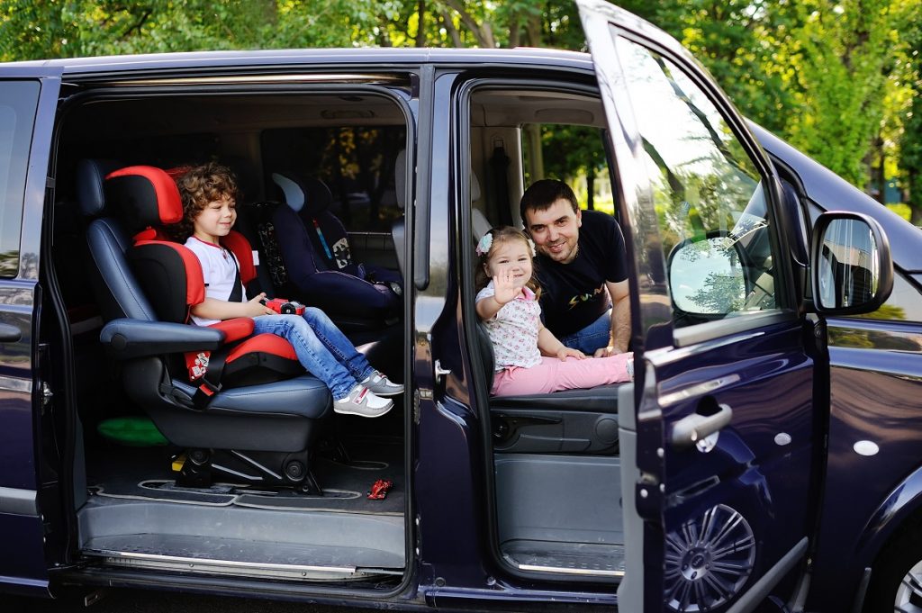 family inside the car on their way for vacation