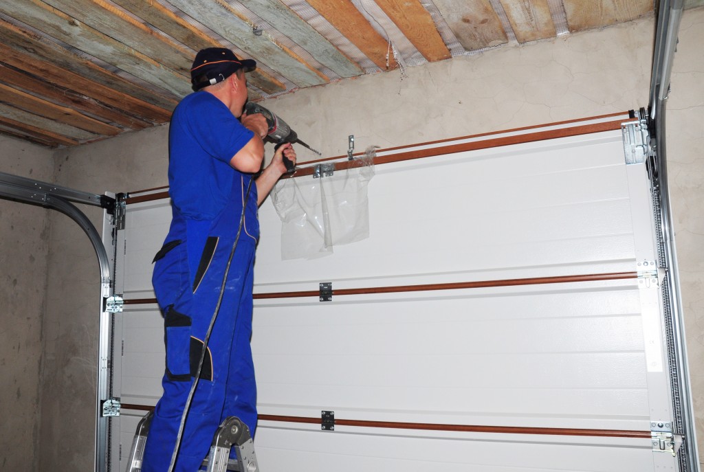 contractor installing garage door