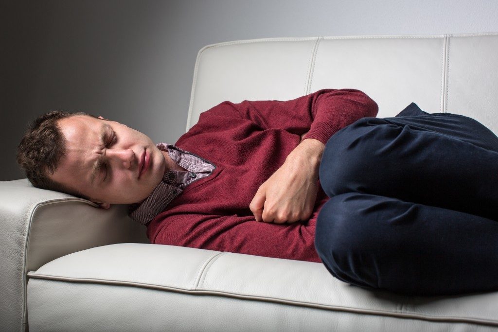 man with pain in abdomen