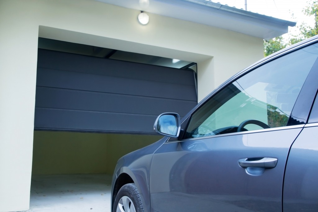 Automatic and convenient garage doors opening for a car