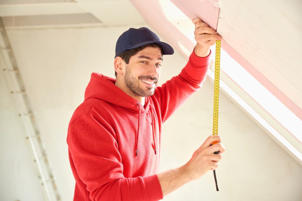 man holding a tape measure