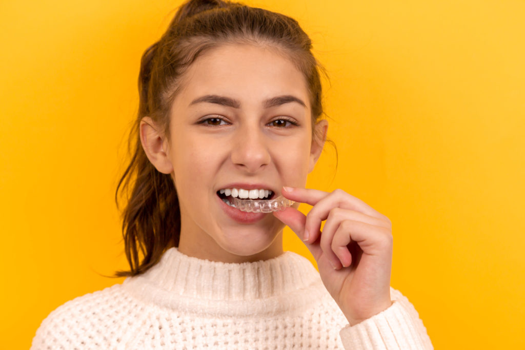 woman wearing invisalign
