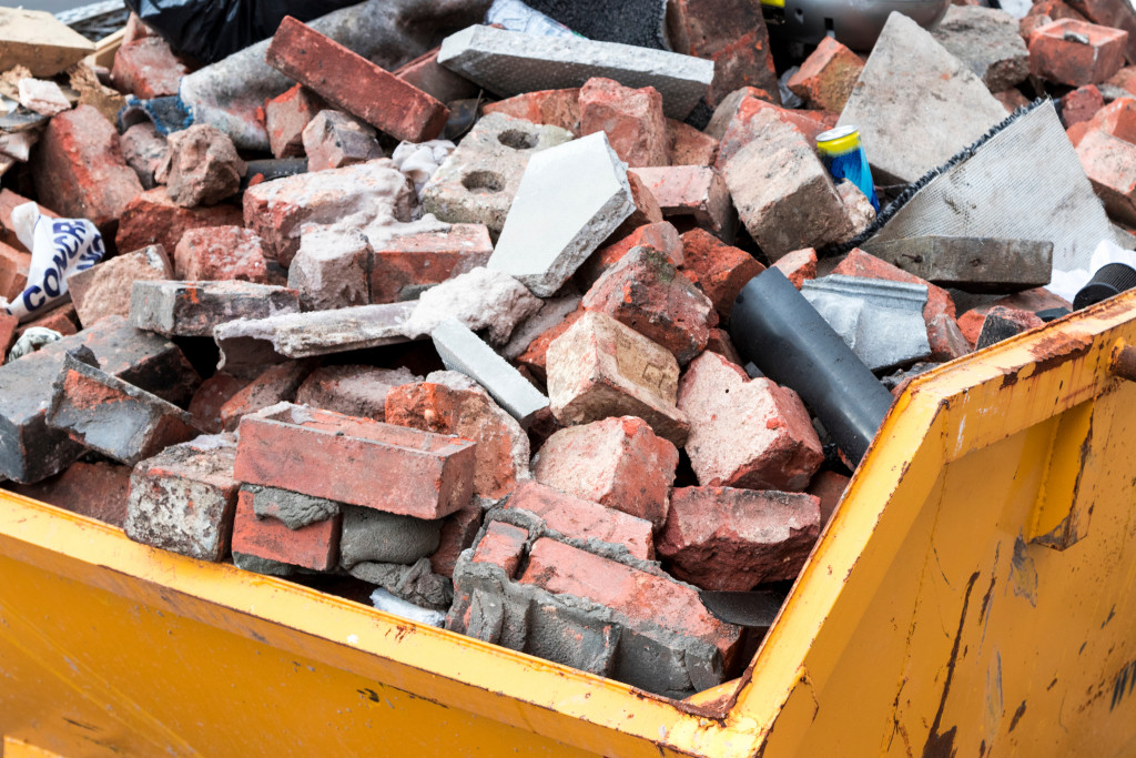 Old bricks and other things from a demolition on a dump truck