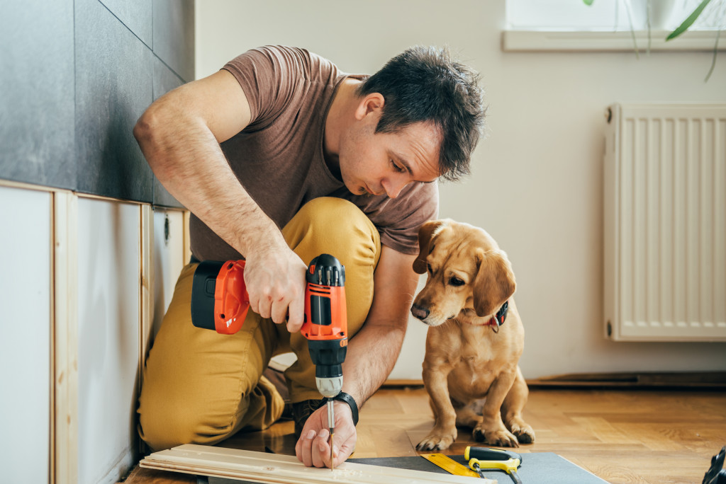 a house worker and a dog