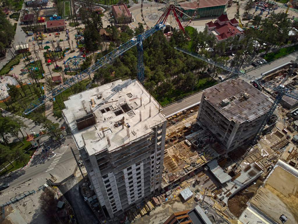 Busy Construction Site and Construction Equipment Aerial Photo top shot